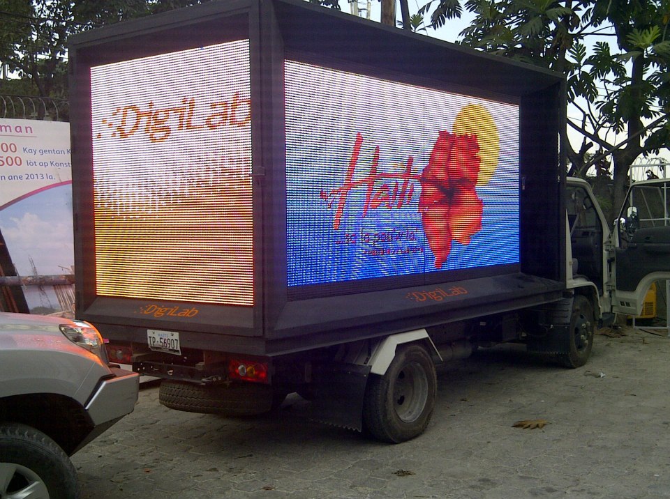 DigiLab Haiti vehicle advertisement for Ministry of Tourism